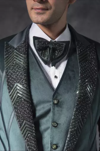 Bottle green zardosi embroidered tuxedo suit on suede fabric