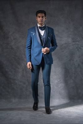 Teal blue tuxedo suit with metal strip detailing 1