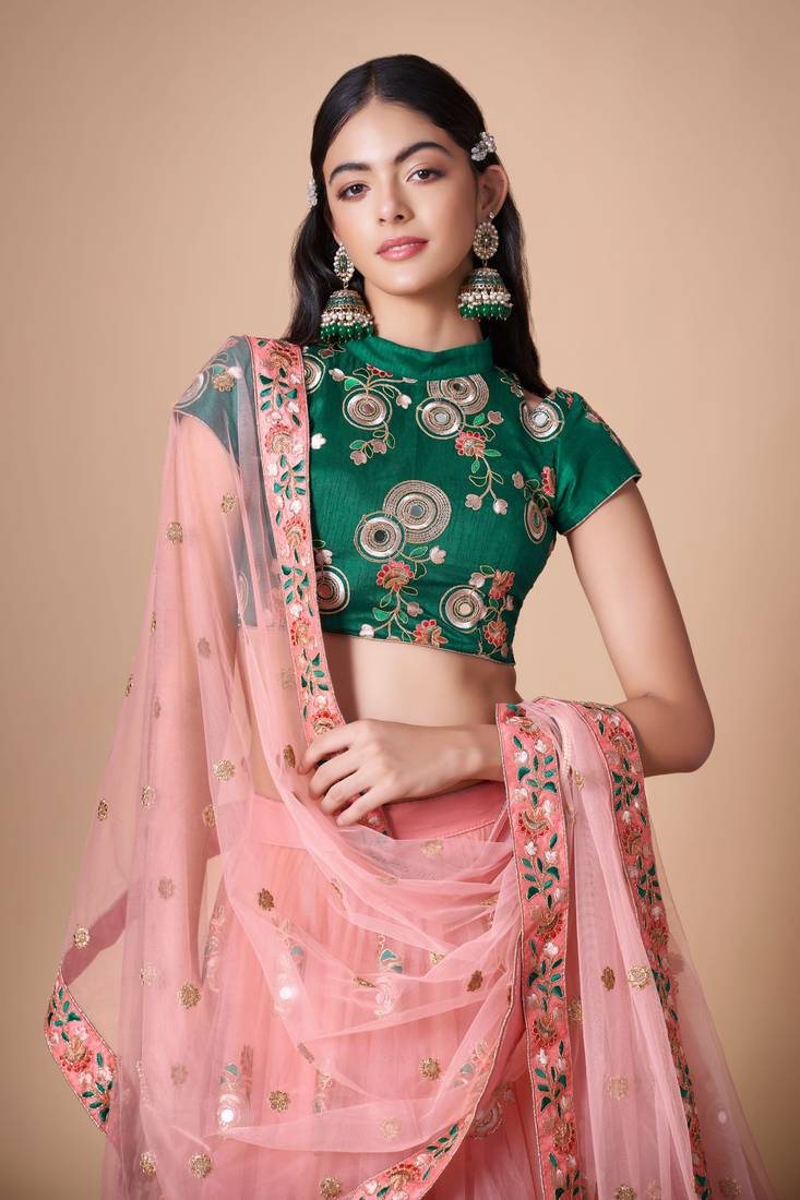 Peach Thread Zari Dori And Sequins Embroidered With Mirror Work Soft Net Lehenga Choli