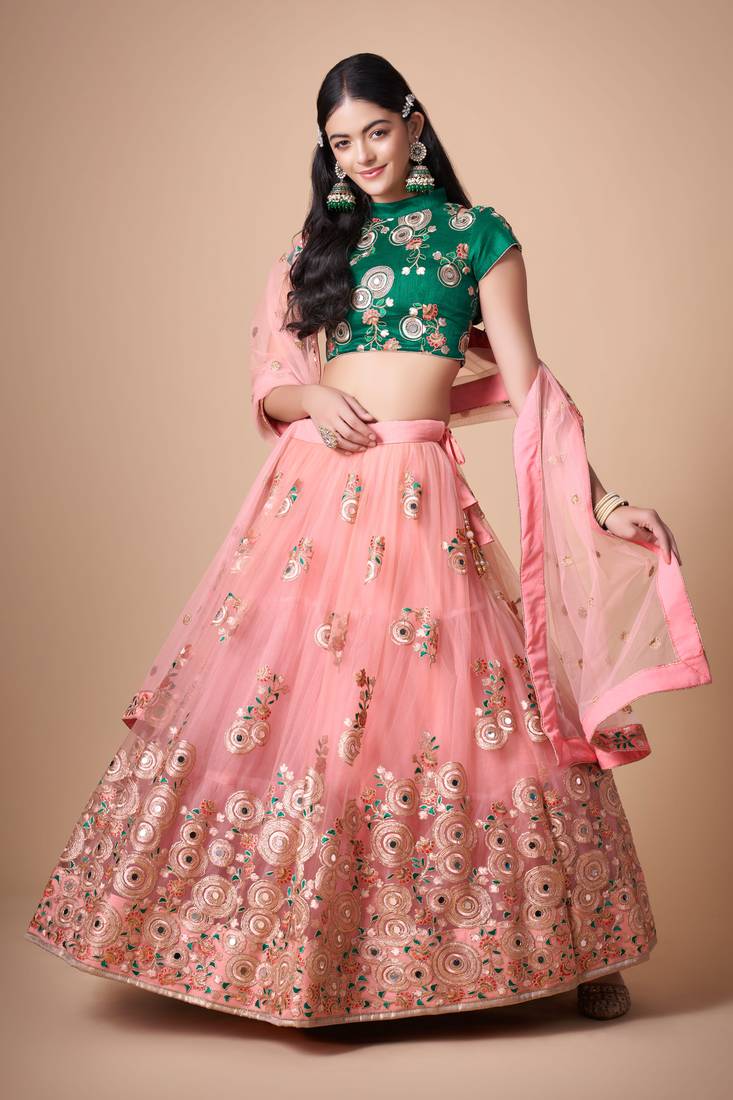Peach Thread Zari Dori And Sequins Embroidered With Mirror Work Soft Net Lehenga Choli