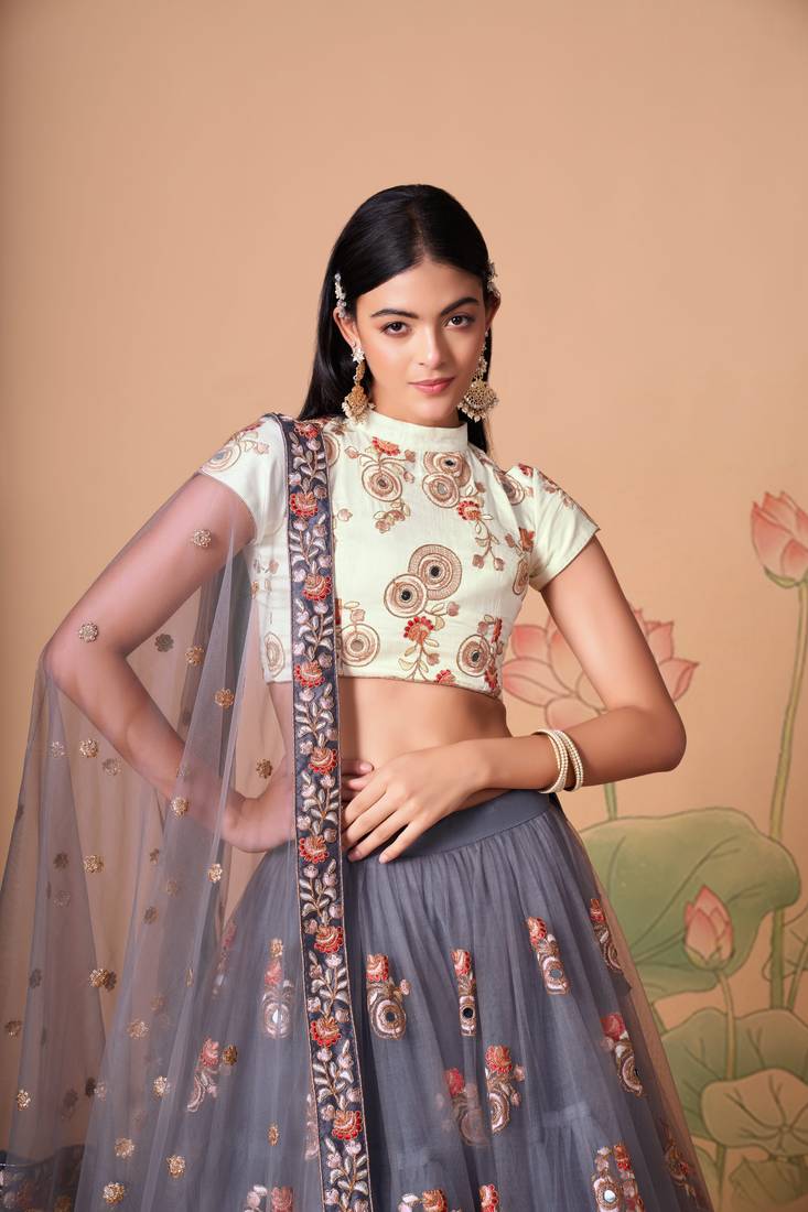 Grey Thread Zari Dori And Sequins Embroidered With Mirror Work Soft Net Lehenga Choli