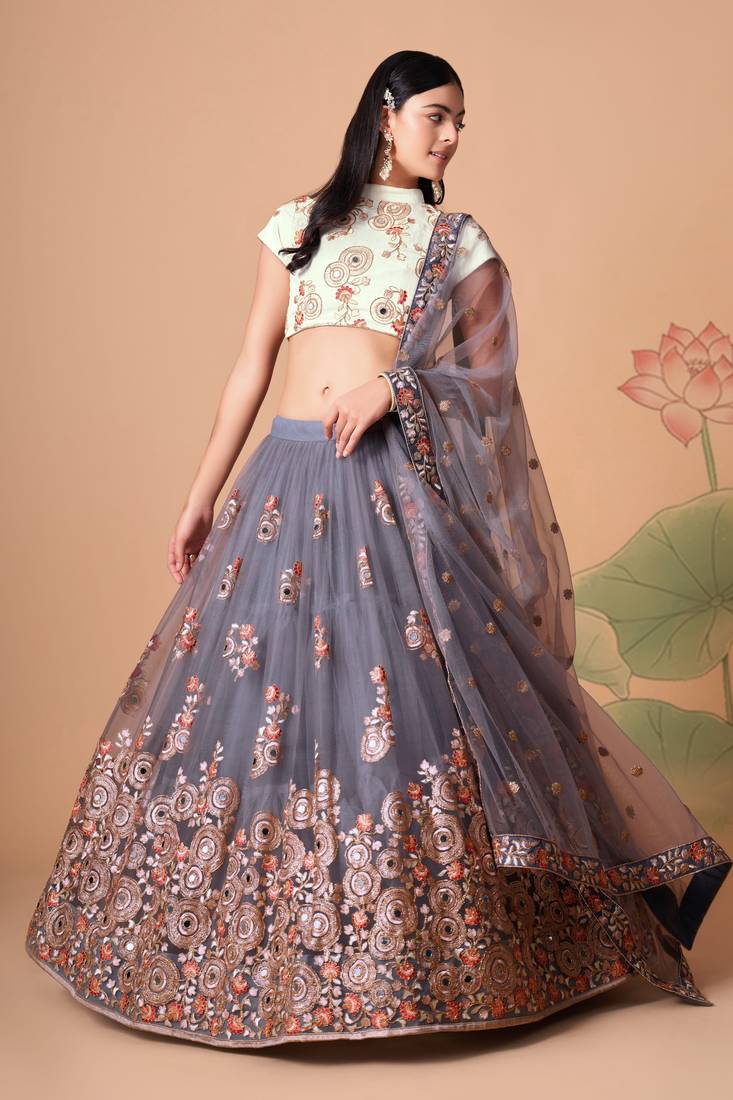 Grey Thread Zari Dori And Sequins Embroidered With Mirror Work Soft Net Lehenga Choli
