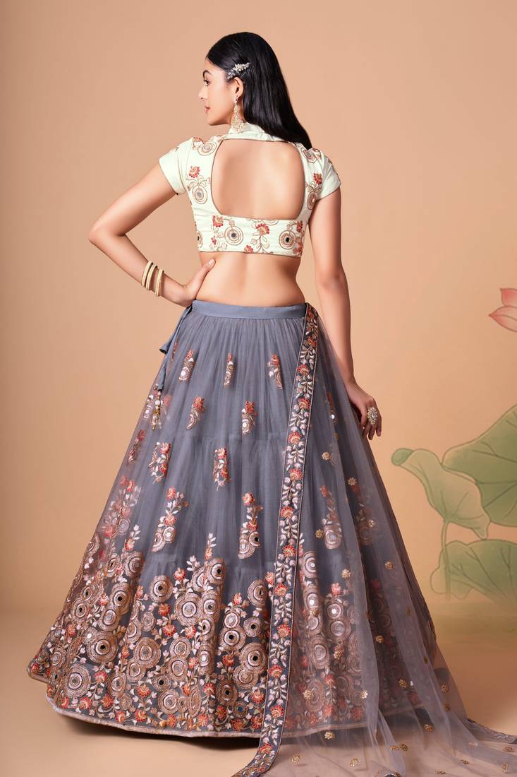 Grey Thread Zari Dori And Sequins Embroidered With Mirror Work Soft Net Lehenga Choli