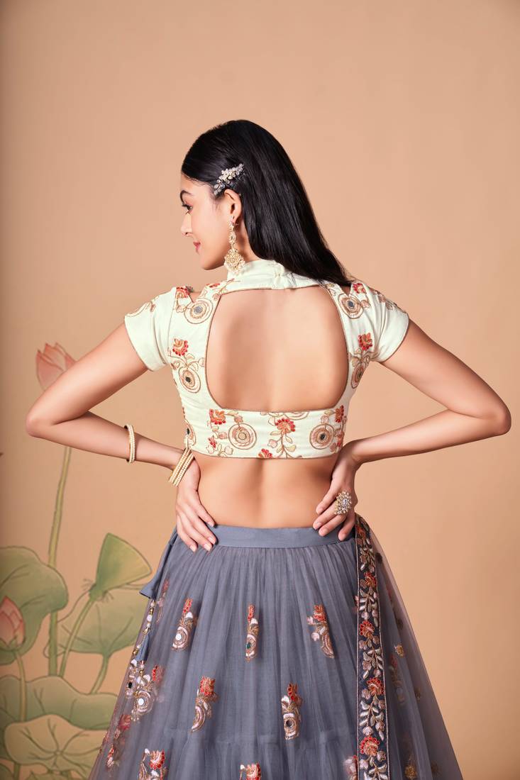 Grey Thread Zari Dori And Sequins Embroidered With Mirror Work Soft Net Lehenga Choli