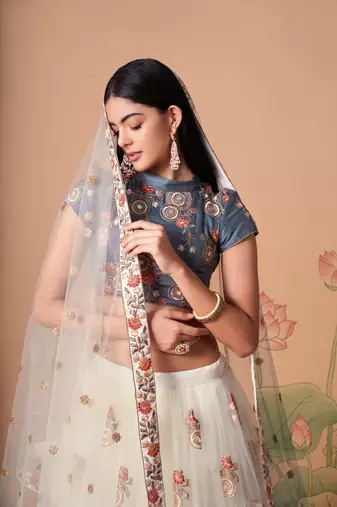 Off White Thread Zari Dori And Sequins Embroidered With Mirror Work Soft Net Designer Lehenga Choli