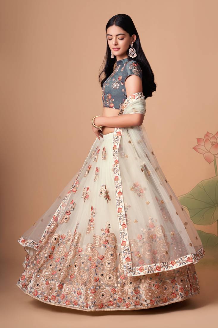 Off White Thread Zari Dori And Sequins Embroidered With Mirror Work Soft Net Designer Lehenga Choli