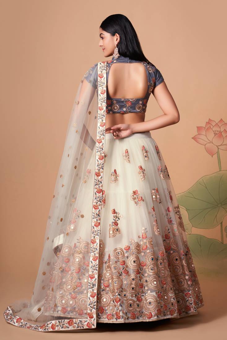 Off White Thread Zari Dori And Sequins Embroidered With Mirror Work Soft Net Designer Lehenga Choli