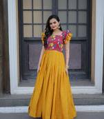 Smartly printed yellow colour muslin and chinon fabric partywear girlish gown