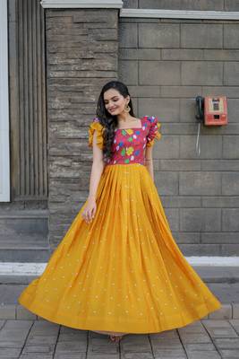 Smartly printed yellow colour muslin and chinon fabric partywear girlish gown 2