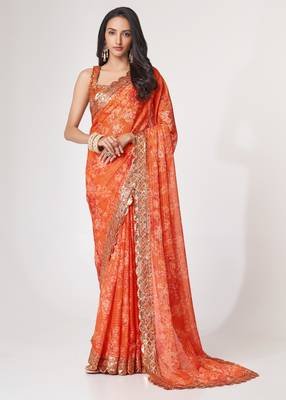 Rich coral-orange gold sequin and zari-style embroidered delicate tonal floral printed indian wedding Saree 1