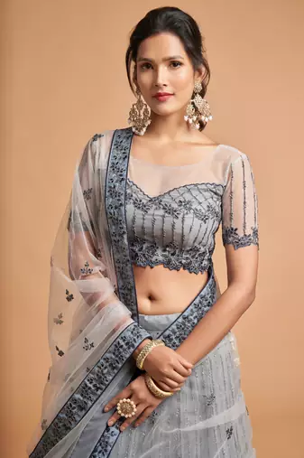 Fetching Grey Zari Badla Dori And Threads Embroidered Soft Net Designer Lehenga Choli
