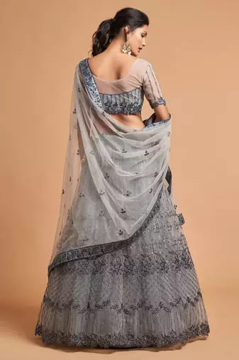 Fetching Grey Zari Badla Dori And Threads Embroidered Soft Net Designer Lehenga Choli