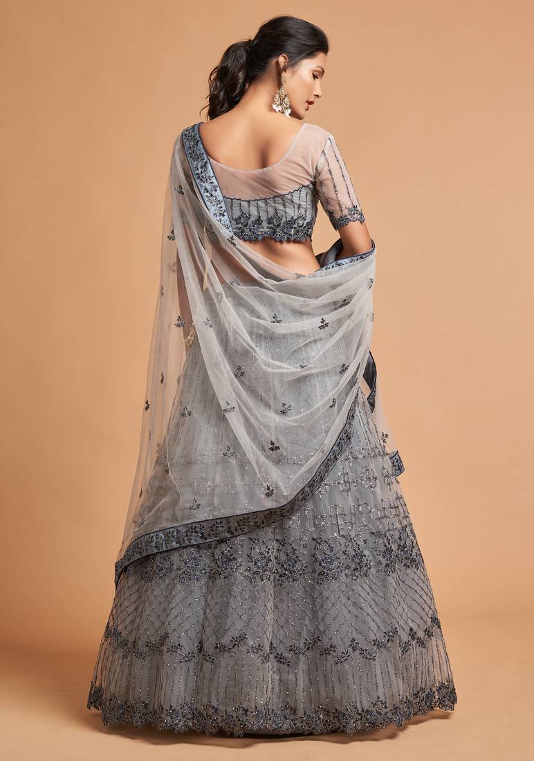 Fetching Grey Zari Badla Dori And Threads Embroidered Soft Net Designer Lehenga Choli