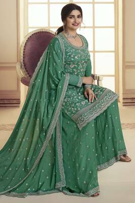 Green colour bollywood style heavy work partywear sharara dress on chinon fabric 1