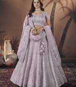 Lavender colour soft net embroidered lehenga for engagement