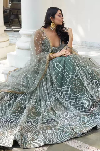 GREEN NET FABRIC LEHENGA CHOLI WITH SEQUINS AND THREAD EMBROIDERY WORK