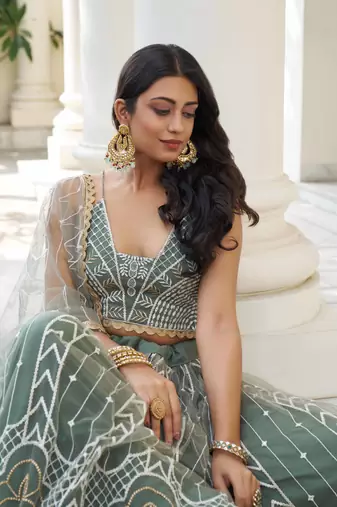 GREEN NET FABRIC LEHENGA CHOLI WITH SEQUINS AND THREAD EMBROIDERY WORK