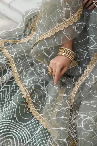 GREEN NET FABRIC LEHENGA CHOLI WITH SEQUINS AND THREAD EMBROIDERY WORK