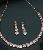 Asymmetrical american diamond necklace set in rose gold, paired with delicate earrings. a modern twist on elegance.