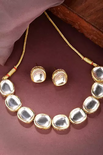 Women gold  handcrafted kundan-studded jewellery set