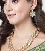 Women rhodium-plated kundan-studded necklace and earrings