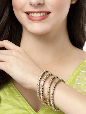 Women set of 4 gold-plated kundan-studded traditional bangles 1