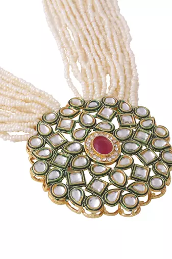 Women gold-plated kundan studded jewellery set