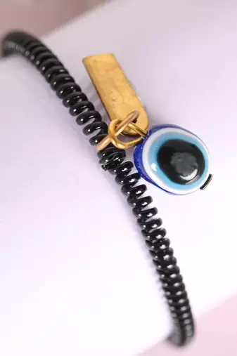 Unisex black evil eye crystal spring ring bracelet