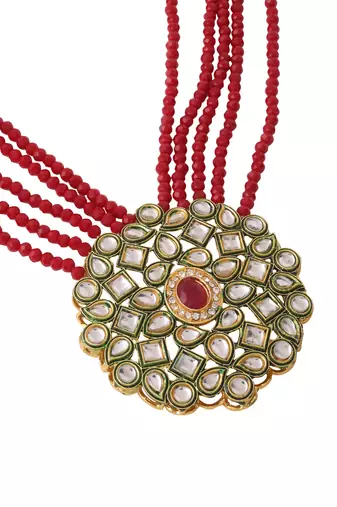 Women gold-plated kundan studded jewellery set