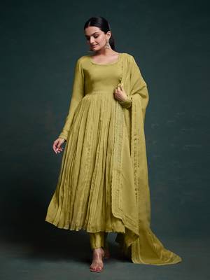 A olive green color anarkali suit with lace detailing ,paired with a lightweight matching dupatta. 1