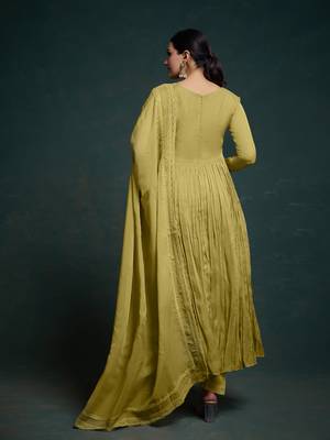 A olive green color anarkali suit with lace detailing ,paired with a lightweight matching dupatta. 4