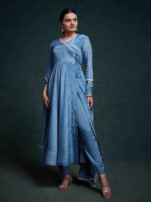 A classic blue polka dot anarkali kurta paired with pants, a flared hemline and detailed lace trim for a timeless look. 1