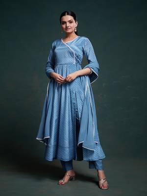A classic blue polka dot anarkali kurta paired with pants, a flared hemline and detailed lace trim for a timeless look. 2