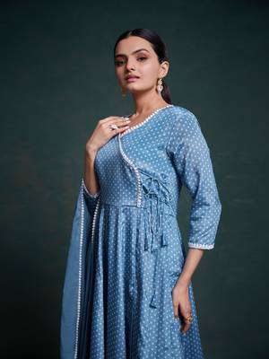 A classic blue polka dot anarkali kurta paired with pants, a flared hemline and detailed lace trim for a timeless look. 3