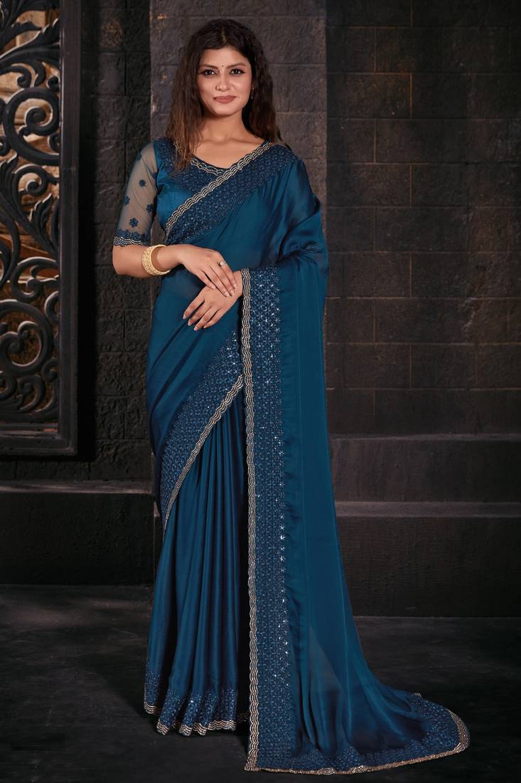 Teal blue coloured sequined zari resham embroidered chiffon silk saree with blouse piece