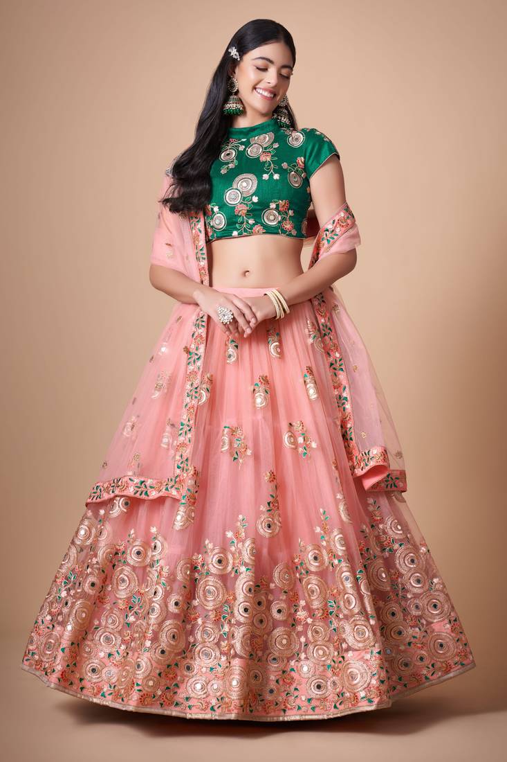 Peach Thread Zari Dori And Sequins Embroidered With Mirror Work Soft Net Lehenga Choli