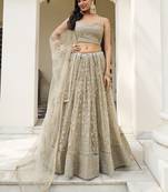 Mesmerizing Ivory Sequins Net Engagement Wear Lehenga Choli