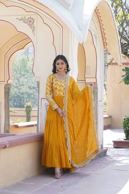 Yellow colour ethnic looking girlish partywear gown with dupatta 1