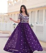 Sophesticated purple colour ethnic rich looks gown for party looks