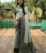Green woven design kanjivaram soft satin silk blend saree with blouse