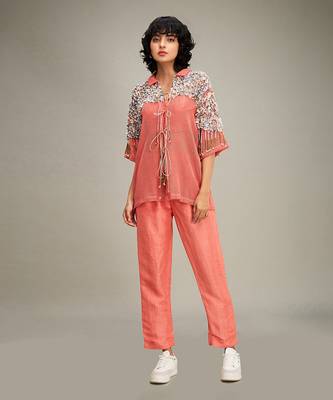 Coral conversational co ord with embellished jacket. 1