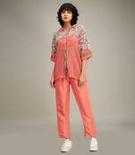 Coral conversational co ord with embellished jacket.