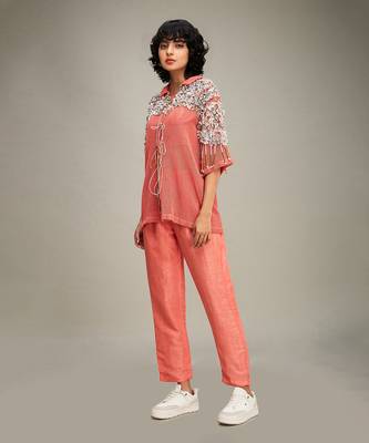 Coral conversational co ord with embellished jacket. 3