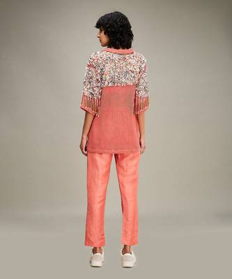Coral conversational co ord with embellished jacket. 4