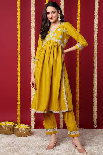Women yellow embroidered silk blend stiched flared kurta trousers suit set