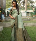 Green woven design kanjivaram soft silk blend saree with blouse