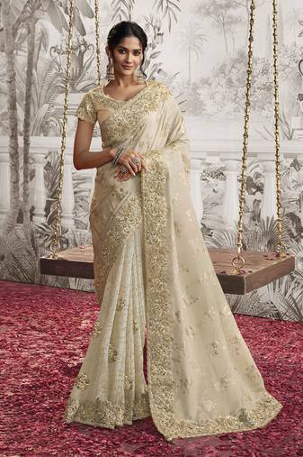 Beige colour crush georgette embroidered saree by monjolika fashion