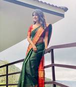 Green woven design lichi silk saree with blouse
