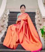 Pink woven design lichi silk saree with blouse