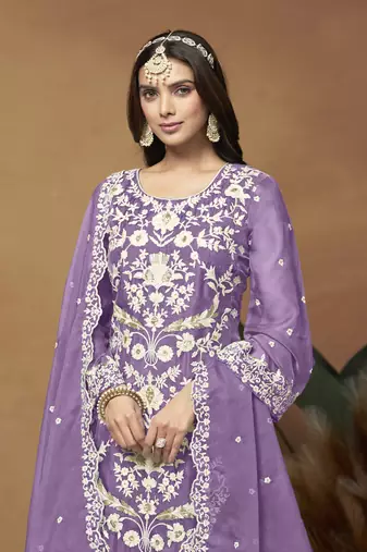 Beautiful lavender colour pakistani style suit on organza fabric for trendy party looks